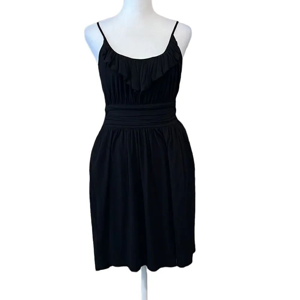 LBD Adjustable straps ruffle at neck waist has pleated front gathered back ties